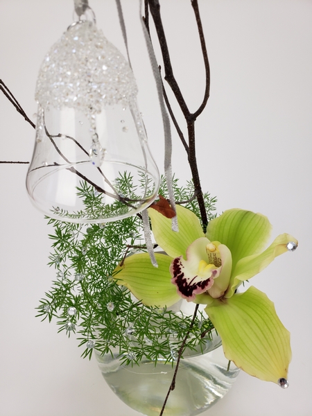 Swarovski crystal bell in a flower arrangement