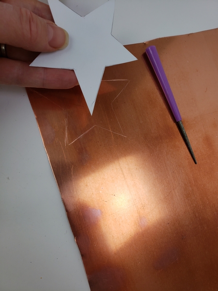 Trace the shape on to a copper sheet