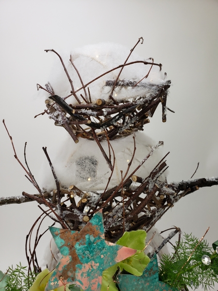 Twig and foam snowman with Christmas lights