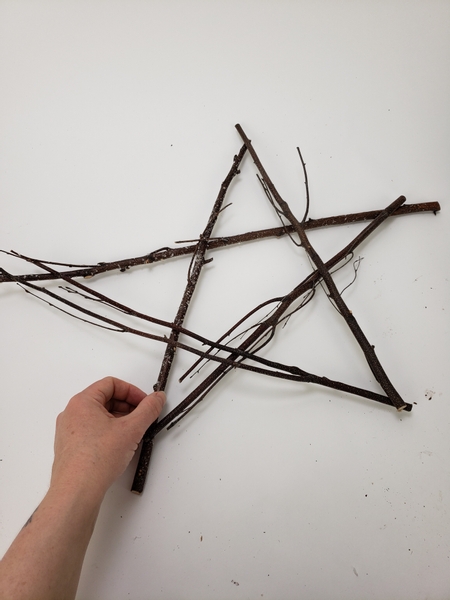 And craft the fifth point of the star by connecting the last twig