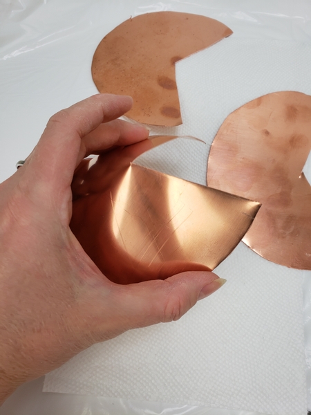 Carefully curve the copper circle