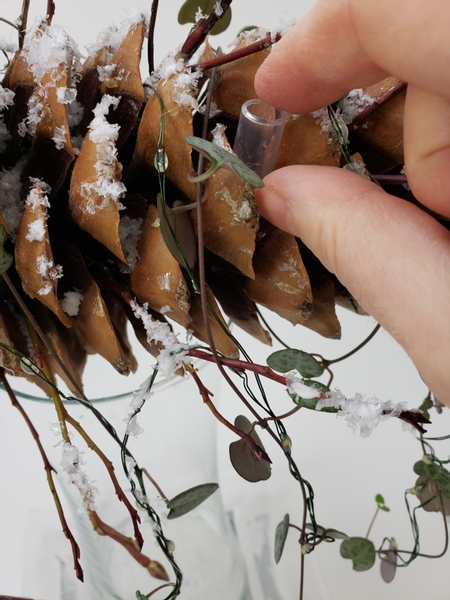 Glue in a few water tubes to keep the fresh flowers hydrated