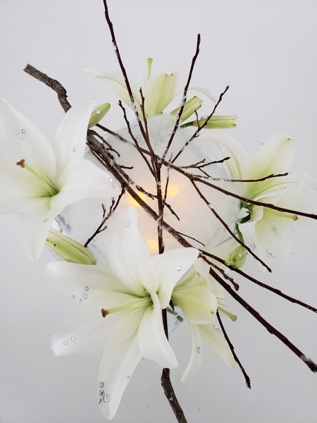 Flameless candles in a winter white centerpiece