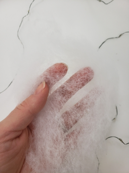 Fluff out filler or cotton wool into a long section Fluff out filler or cotton wool into a long section