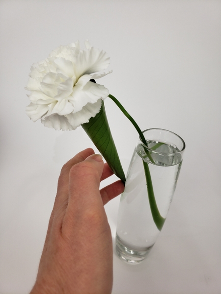Place the foliage in a bud vase to hydrate