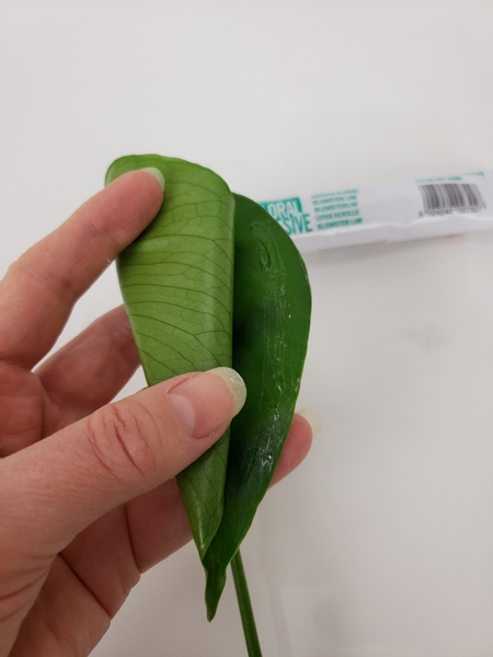 Secure the leaf into the cone shape with floral glue