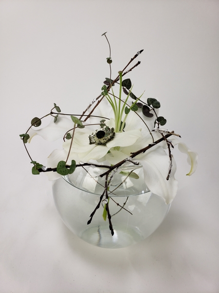 Snow covered twigs and white flowers for minimal floral styling
