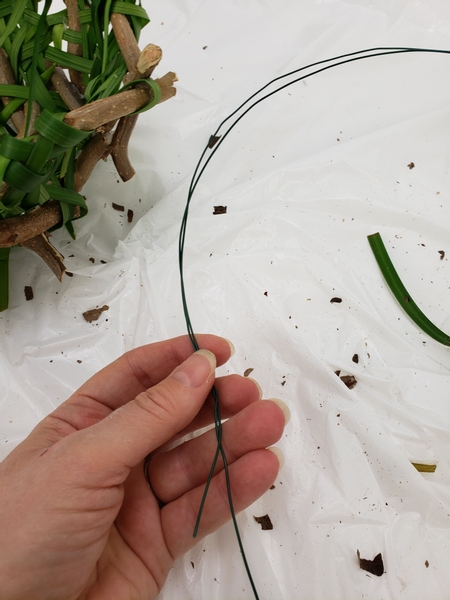 Cut some sturdy wire to craft the basket handles.