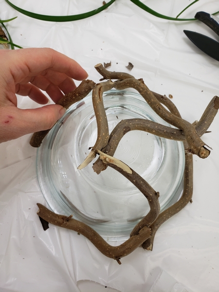 Place the twig snippets all around the bowl and secure them with hot glue