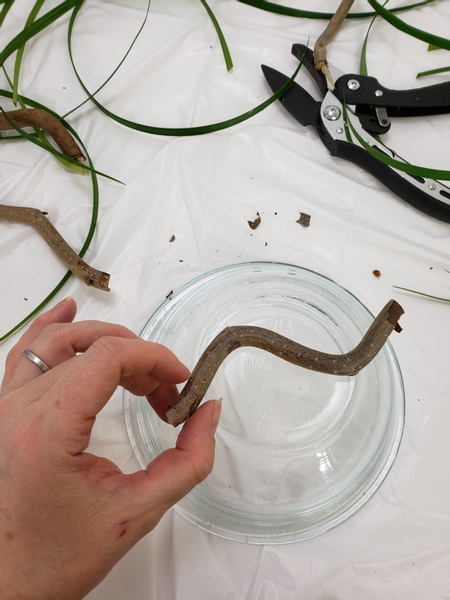 Use an upturned bowl to shape the twig basket frame