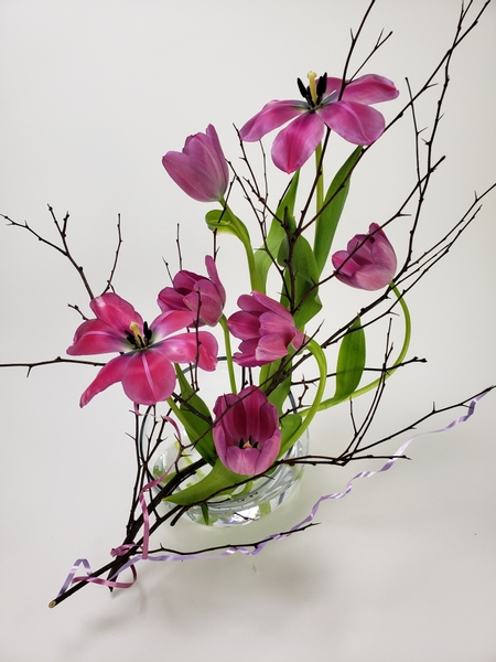 Contemporary floral design using tulips and thorn branches