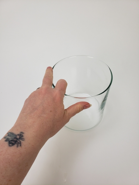 Place a glass container on your design table Place a glass container on your design table