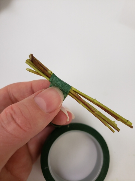 Secure the stems into a bundle with florist tape