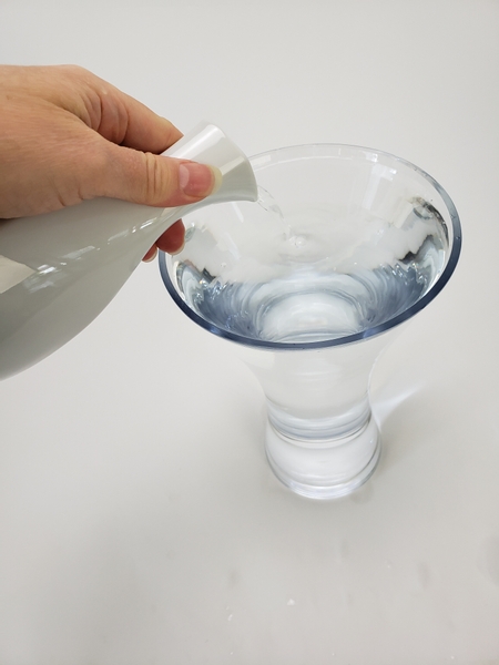 Fill a large vase with water