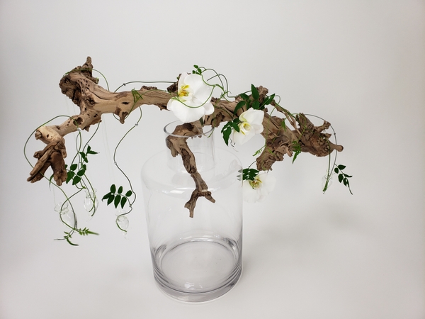 Flower arranging on driftwood