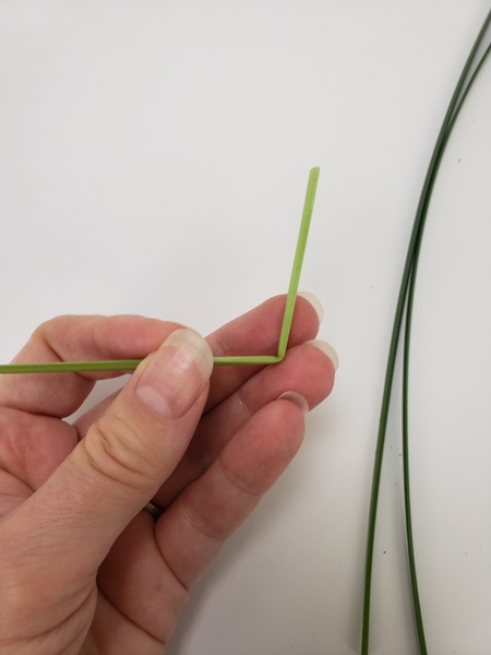 Fold a blade of grass at a sharp angle