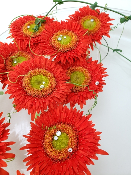Bright orange gerberas in a minimal autumn flower arrangement