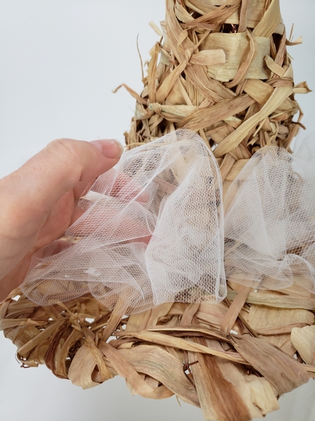 Glue the puff of tulle every here and there around the brim of the hat