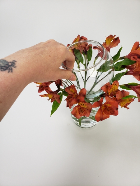 Measure and fit a fishbowl vase to make sure it fits on the stems
