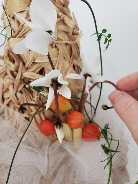 Slip the flowers into the water tube