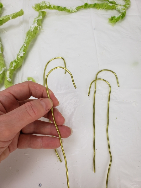 Cut four more wires to shape into candy canes.