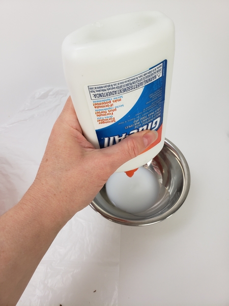 Pour out wood glue into a bowl