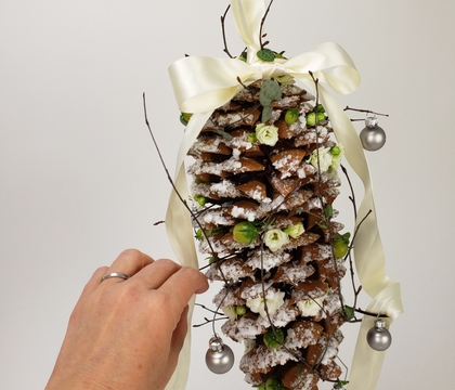 Snowy Pinecone with green tomato berries and Kalanchoe flowers