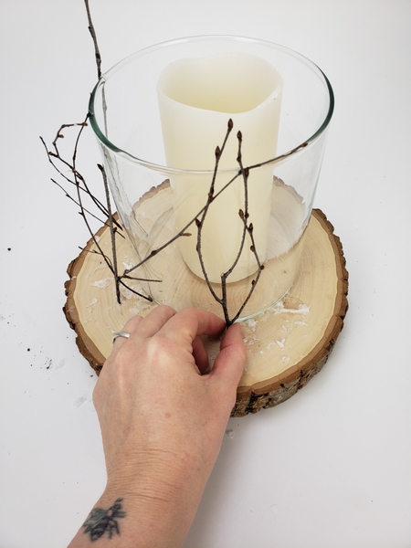 Move around the vase and glue in delicate twigs