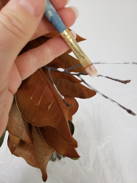 Paint the twigs with wood glue