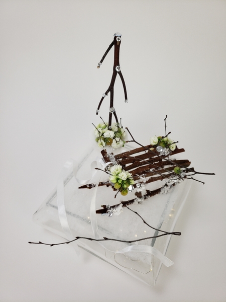Twig sleigh and Christmas tree floral design