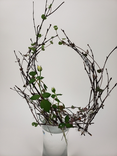 Snow covered twig armature for sustainable floral designs in winter