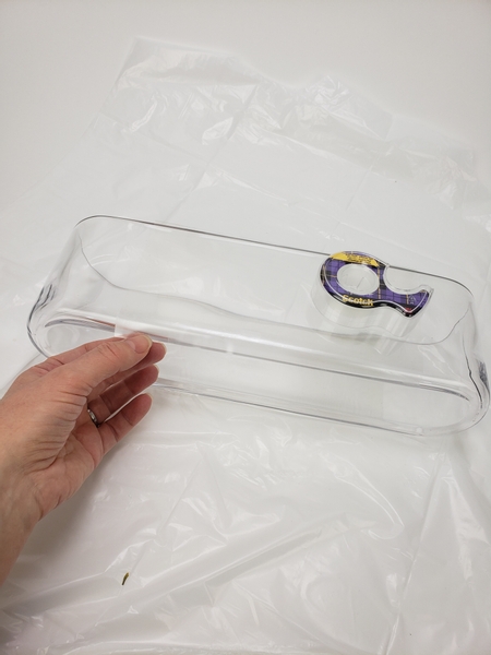 Secure the acetate to the container with clear tape