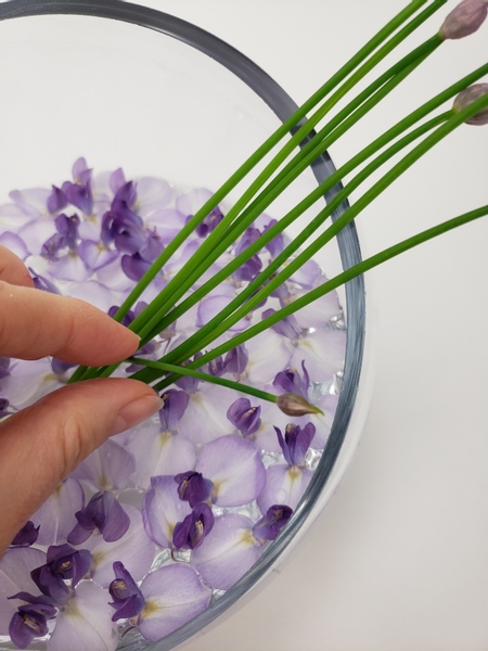 Add in a single chive stem to stand upright into the bundle