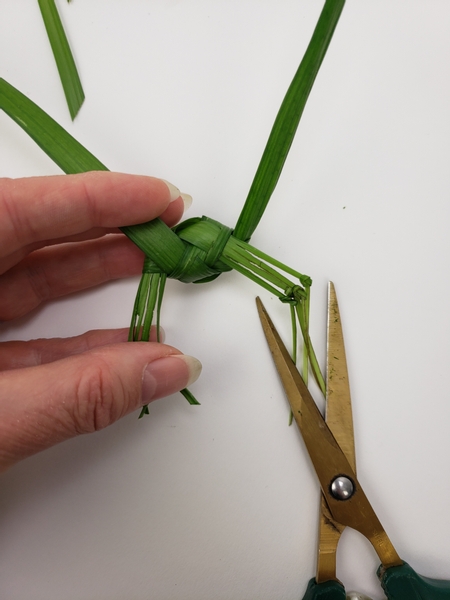 Cut the dangling parts below the knots shorter