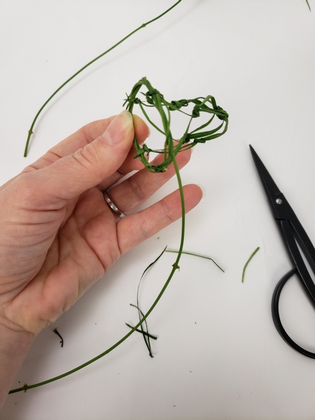 Snip away all the dangling bits of grass to tidy up the net