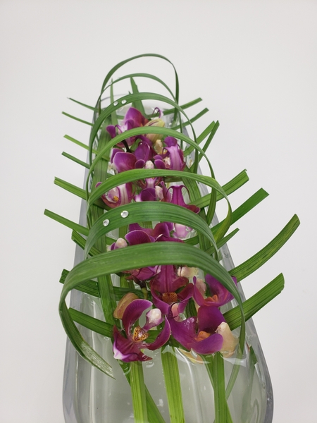 Remove the petals from orchids to add interest to a flower arrangement