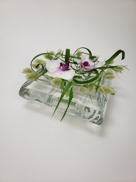 Minimize creating waste in your flower designs by weaving a grass grid