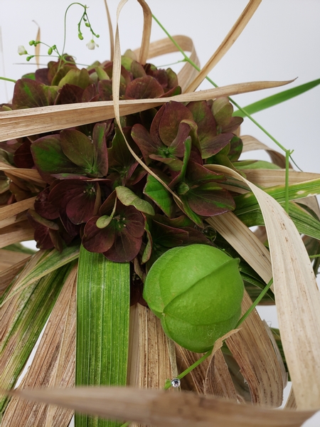 Love in a puff seed pod in a floral design