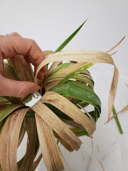 Slip in a few dangling gladiolus leaf tips to break the circle pattern