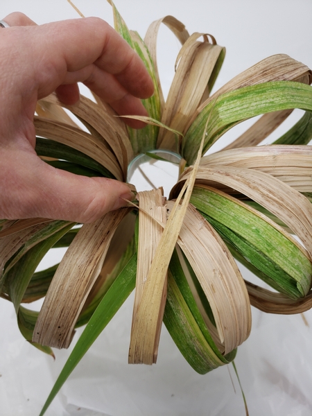 Slip the gladiolus foliage pumpkin over the opening of the vase