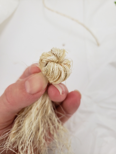 And fold the fluffed out sisal over to shape the head of the ghost