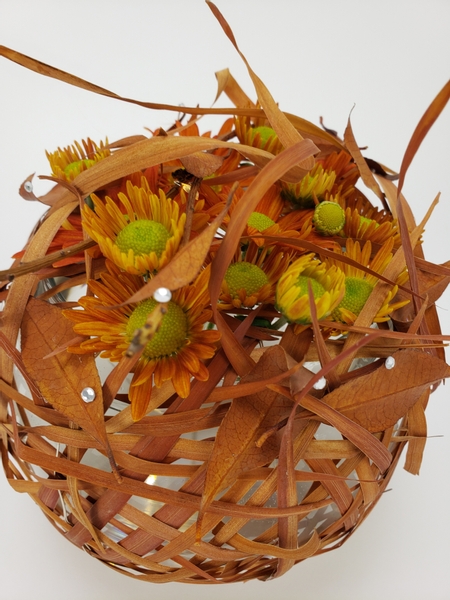 Arranging cut chrysanthemums from your garden for an autumn display