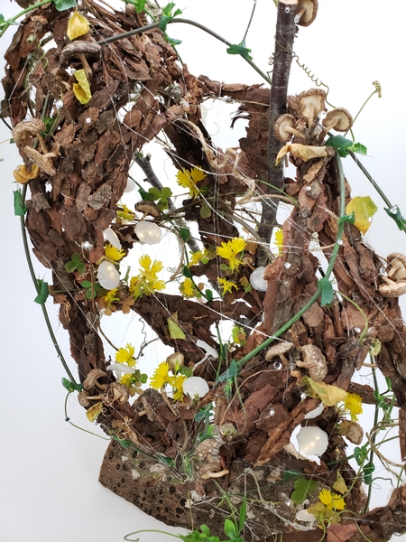 Contemporary floral installation using bark and mushrooms