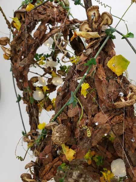 How to make spiderwebs with hot glue for an autumn forest floor floral display