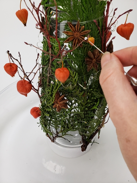 And tiny dew drop crystals to the winter twigs all around the tapered vase