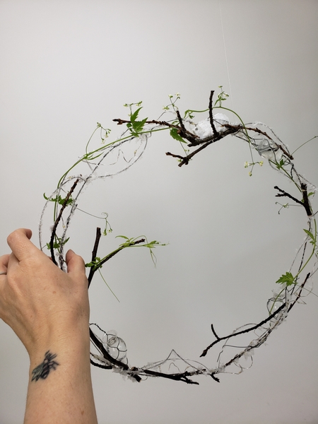 And weave the vine through and around the wreath frame