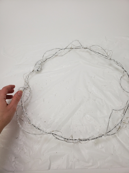 The frosty wire wreath frame is now ready to design with
