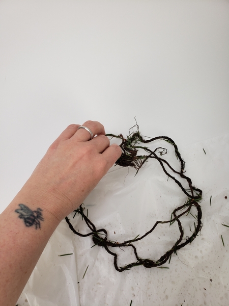 Add a few needles into your wire wreath frame