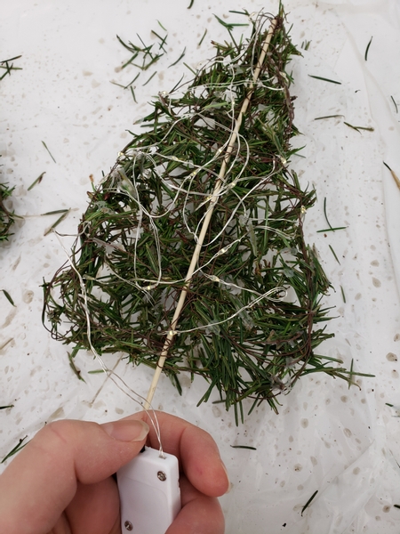 And shape the lights inside the needle and wire tree frame