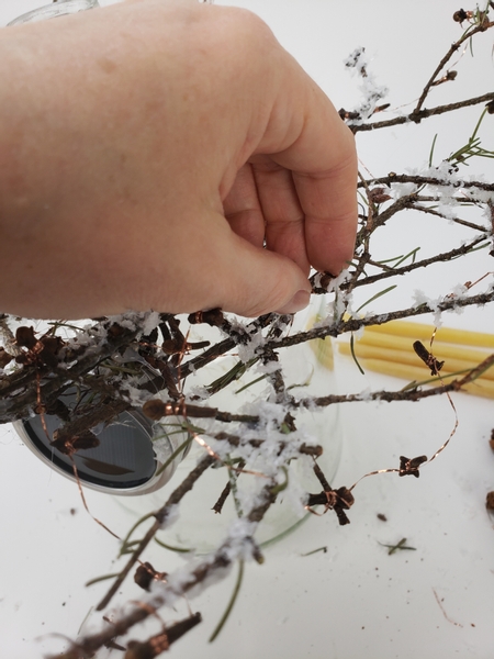 Drape the cloves over the twig wreath